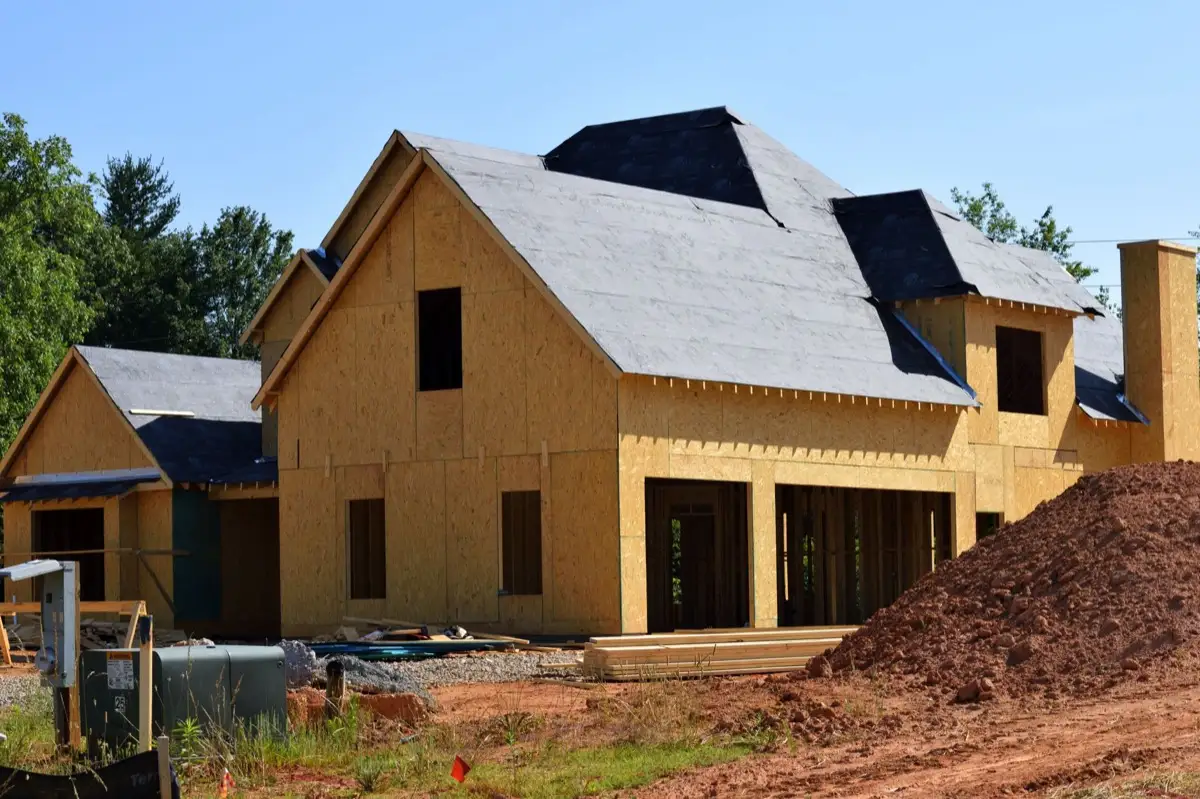House with new roof decking and synthetic underlayment during a roof replacement in Springdale, AR